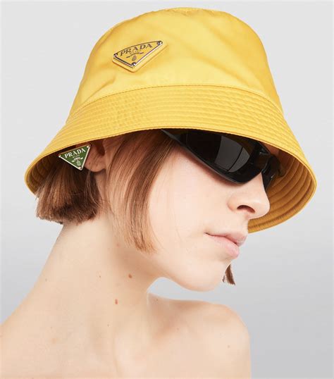 yellow prada bucket hat.